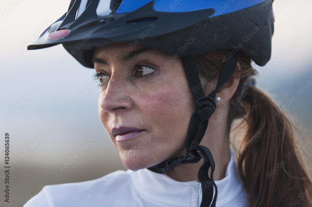 A Woman In A Bicycle Helmet Dripping With Sweat; Tarifa, Cadiz, Andalusia, Spain A Woman In A Bicycle Helmet Dripping With Sweat; Tarifa, Cadiz, Andalusia, Spain