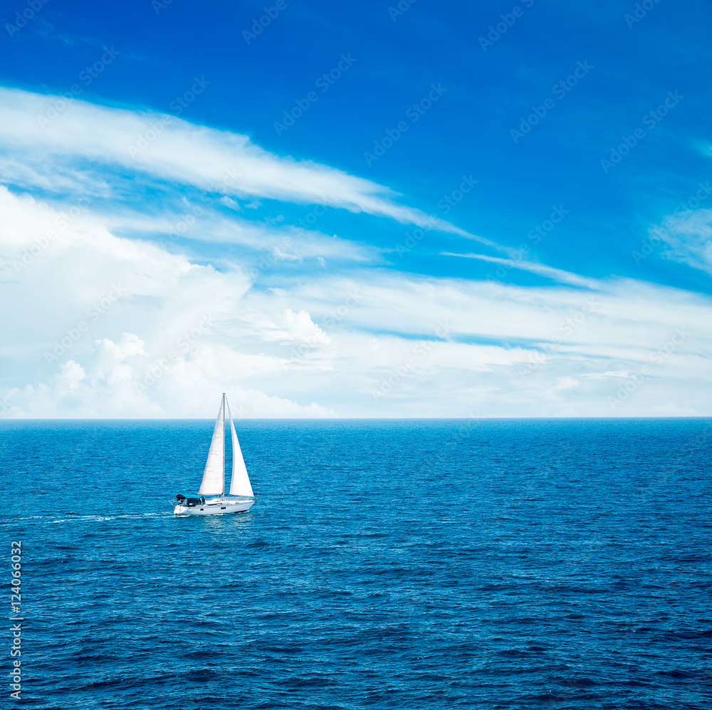 White Yacht Sailing in Blue Sea.