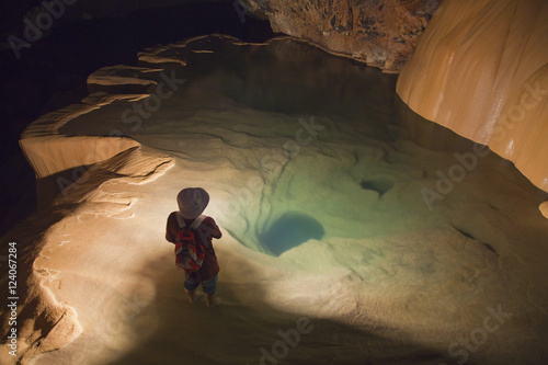 A Filipino Tour Guide Holds A Lantern Inside Sumaging Cave Or Big Cave Near Sagada; Luzon, Philippines photo