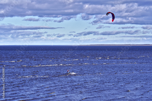 Lone kite surfer at the sea.