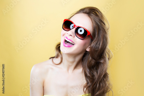 Cheerful woman In sunglasses.