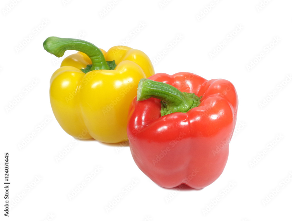 Closed up two ripe bright color bell peppers, one red and one yellow with green stem isolated on white background Closed up two ripe bright color bell peppers, one red and one yellow with green stem isolated on white background
