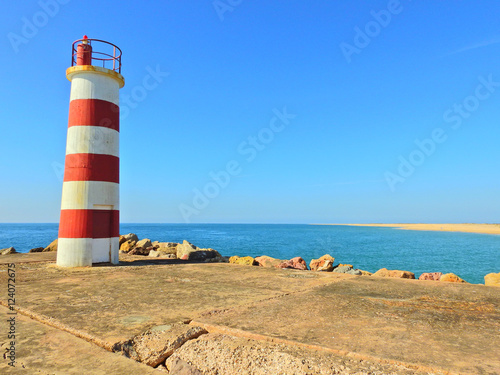 Lighthouse in a Deserted island, Faro, Portugal photo