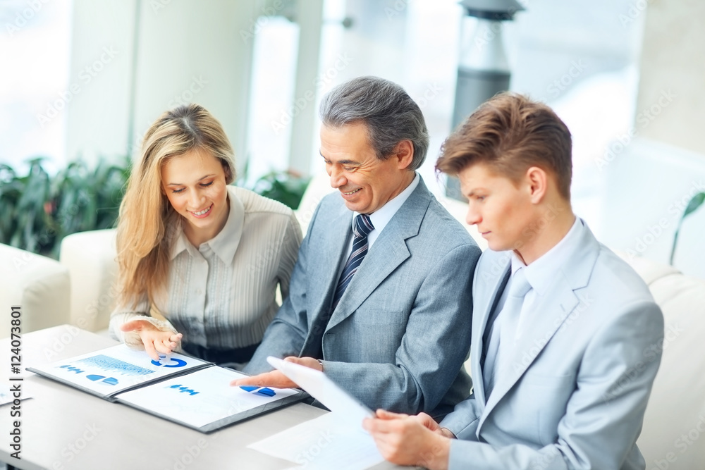 he boss and his business team discussing a financial chart he boss and his business team discussing a financial chart