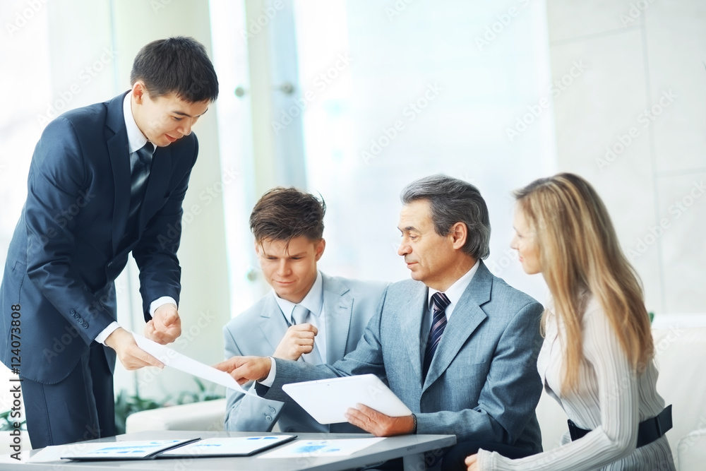 boss with digital tablet and his business team boss with digital tablet and his business team