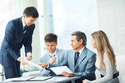 boss with digital tablet and his business team