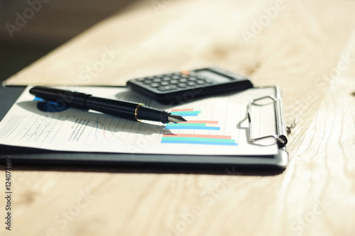 Wallpaper Mural pen, calculator and financial graph on a workplace of the busine Torontodigital.ca