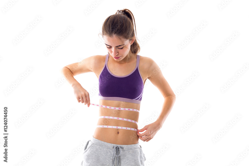 Athletic woman holding cantimeter Athletic woman holding cantimeter