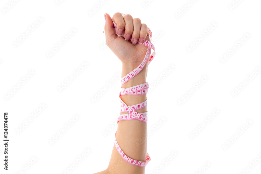 Woman's arm with centimeter around it Woman's arm with centimeter around it