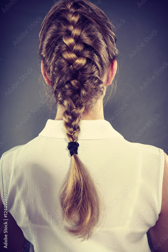 Back view of woman with blonde braid.