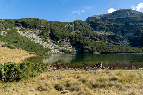 Yonchevo lake and green hills, Rila Mountain, Bulgaria