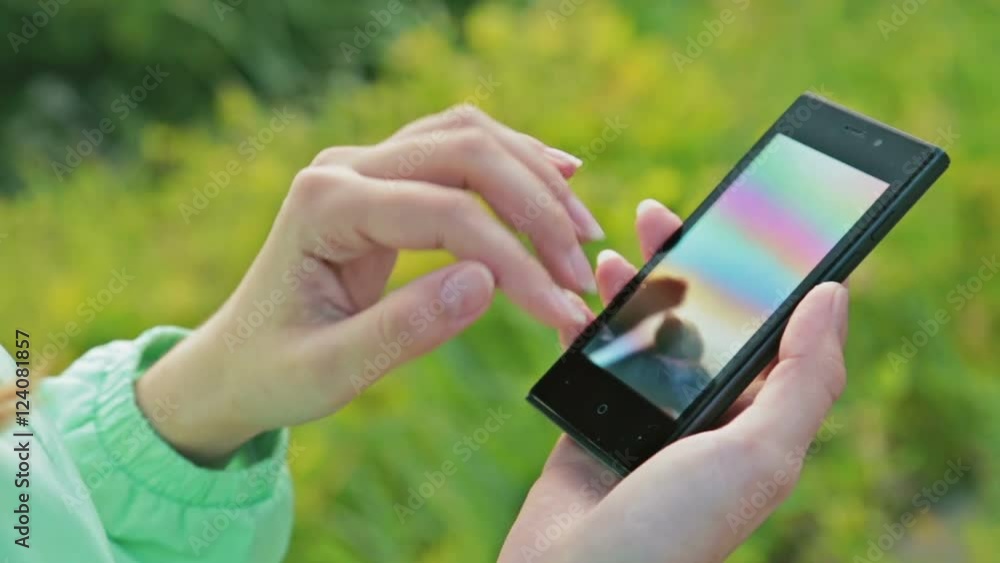Close-Up Woman Using Smart-Phone Outdoors Close-Up Woman Using Smart-Phone Outdoors