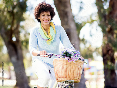 Happy young woman with bicycle © Sergey Nivens