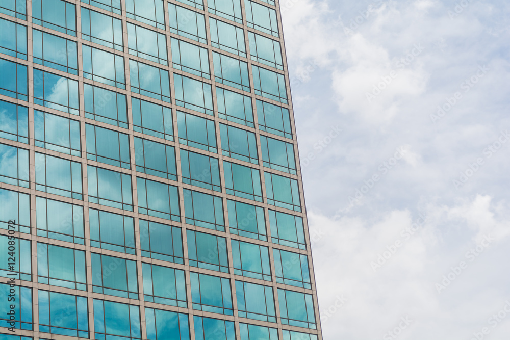 Building glass window pattern with a reflection of blue sky. Building glass window pattern with a reflection of blue sky.