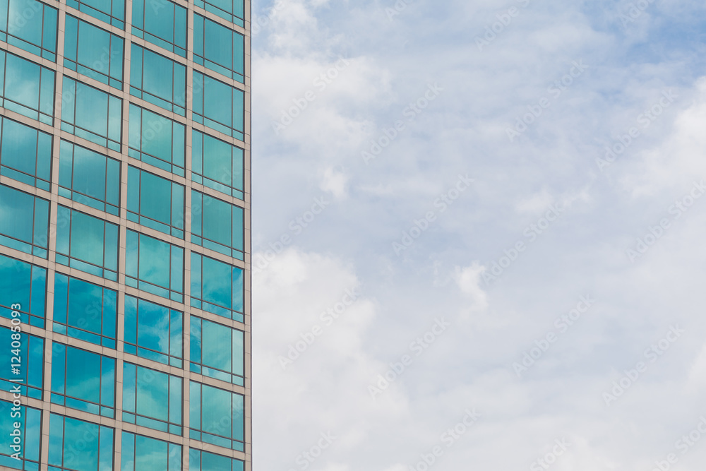 Building glass window pattern with a reflection of blue sky. Building glass window pattern with a reflection of blue sky.