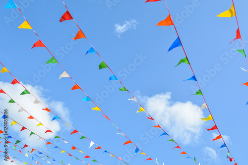 Colorful triangle flags hung across the beautiful blue sky.