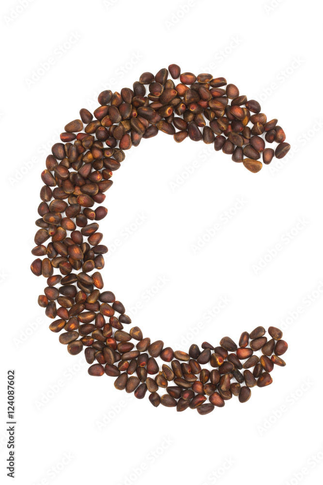 C letter made of cedar nuts C letter made of cedar nuts