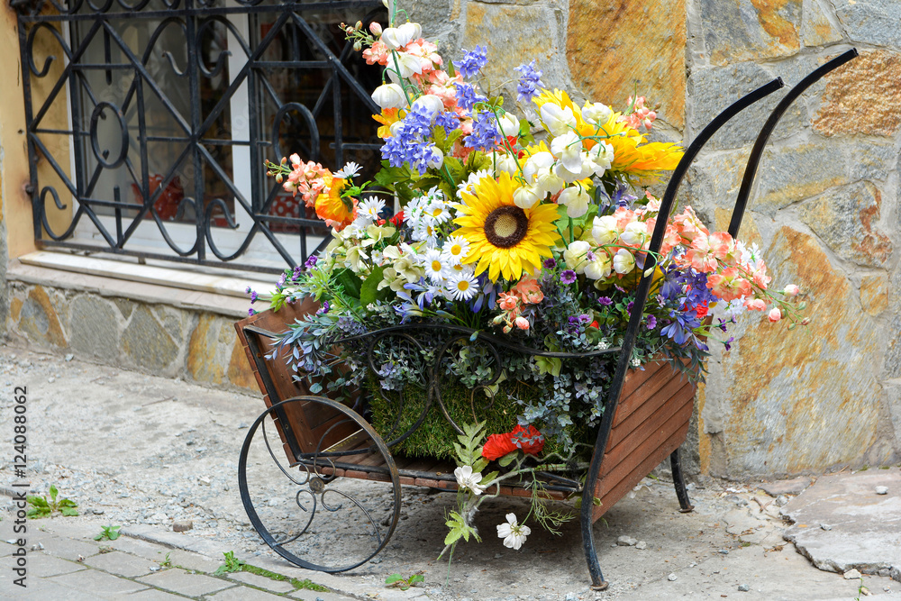 Decorative wood cart with artificial flowers