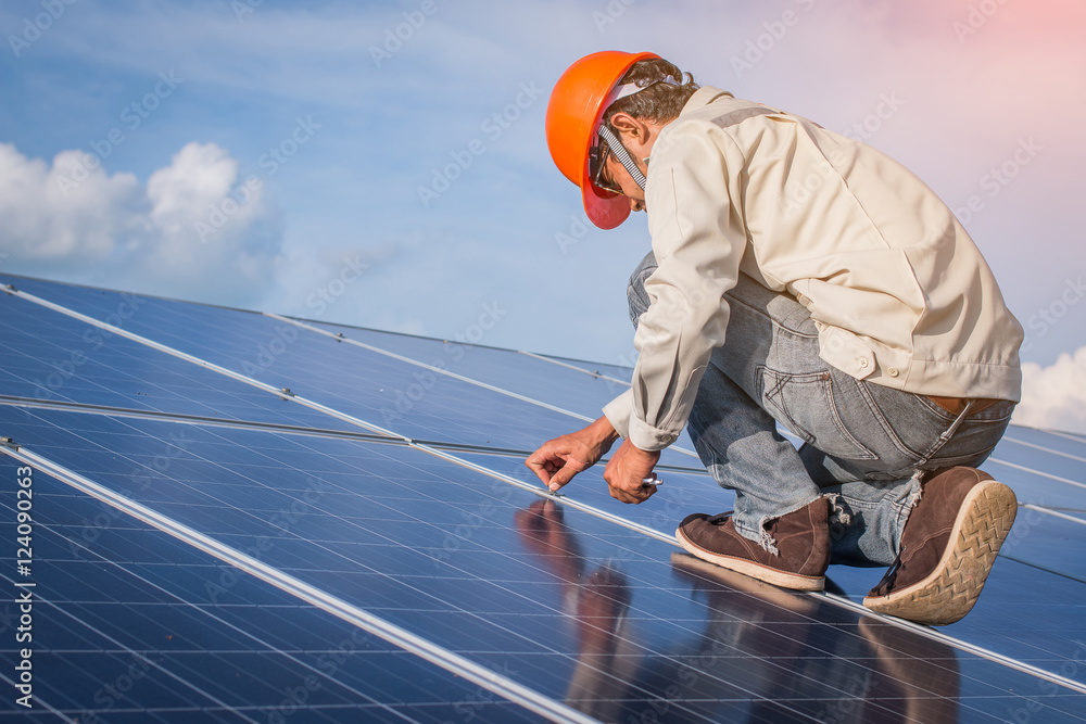 engineer working on maintenance equipment at green energy solar power plant: working on Wrench tightening at solar mounting structure engineer working on maintenance equipment at green energy solar power plant: working on Wrench tightening at solar mounting structure