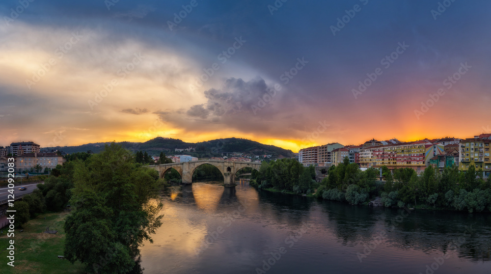 Sunset on a stormy day on the city of Ourense
