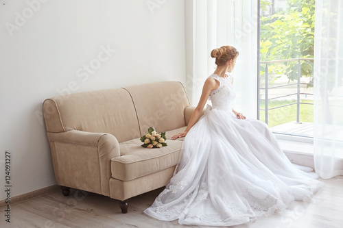 Bride in beautiful dress wi...