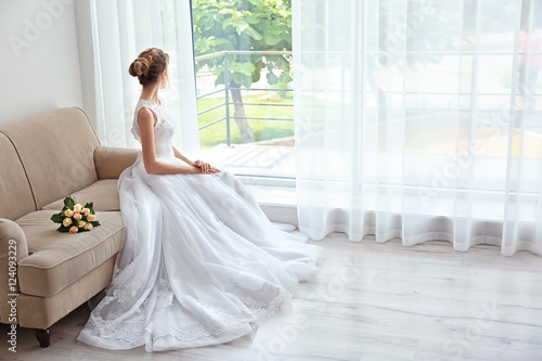 Bride in beautiful dress wi...