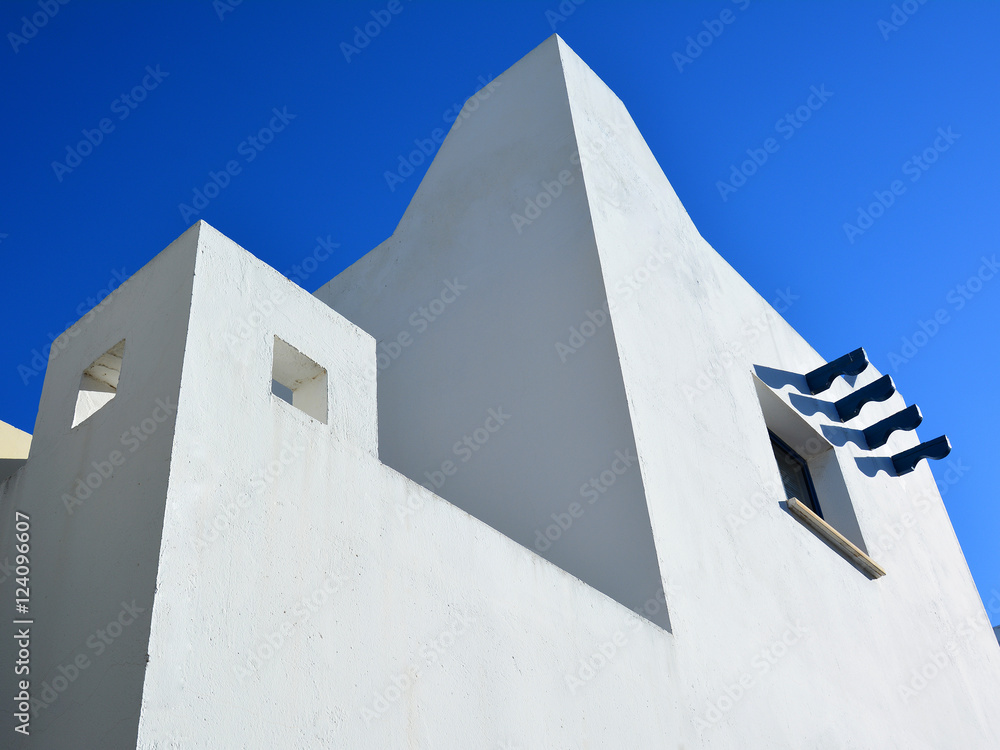 Classic white Greek house a blue sky background