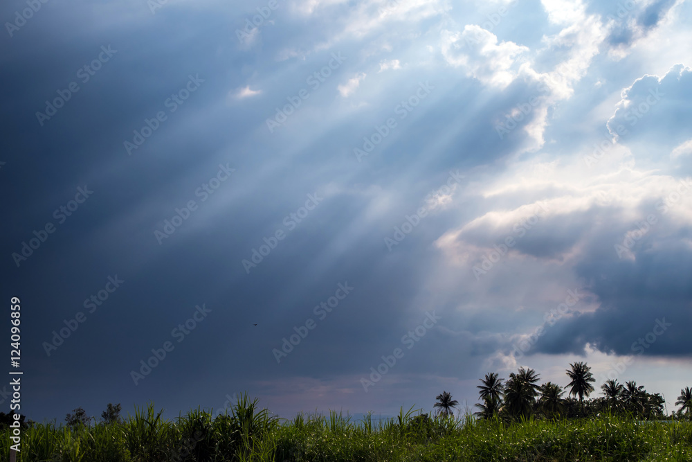 Beam of Sunlight behind dark clouds Beam of Sunlight behind dark clouds