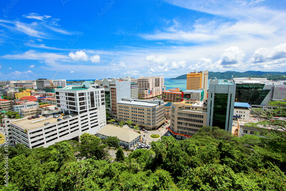 Fototapeta premium Cityscape view from mountain hell with sea and blue sky background landscape