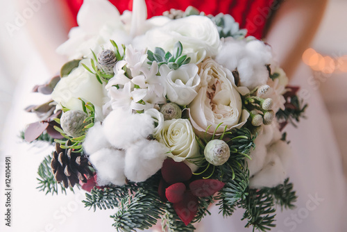 Christmas bridal bouquet. A beautiful bouquet of white flowers, cotton, and fir branches