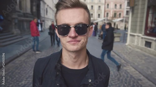 Closeup portrait of a young man in sunglasses