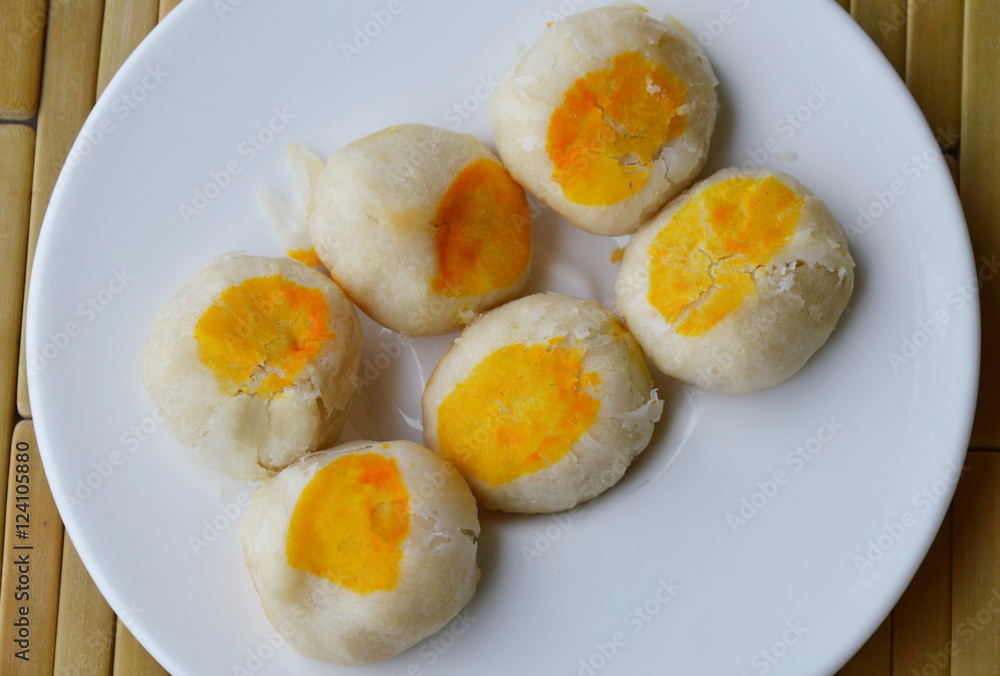 Chinese pastry filling sweet bean and salty egg yolk on dish Chinese pastry filling sweet bean and salty egg yolk on dish