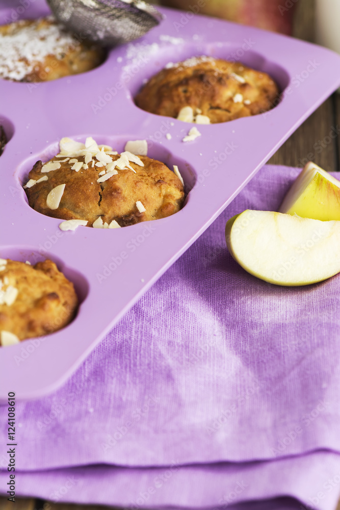 Apple cupcakes over wooden table