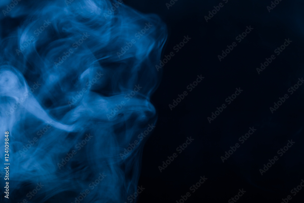 Cloud of smoke on black background. Selective focus. Toned Cloud of smoke on black background. Selective focus. Toned