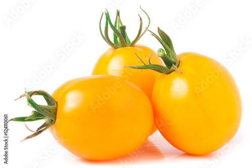 three yellow tomato isolated on white background