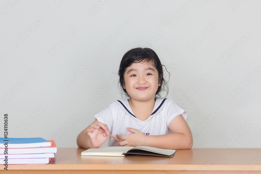 Beautiful little girl looking focused and concentrated on doing Beautiful little girl looking focused and concentrated on doing