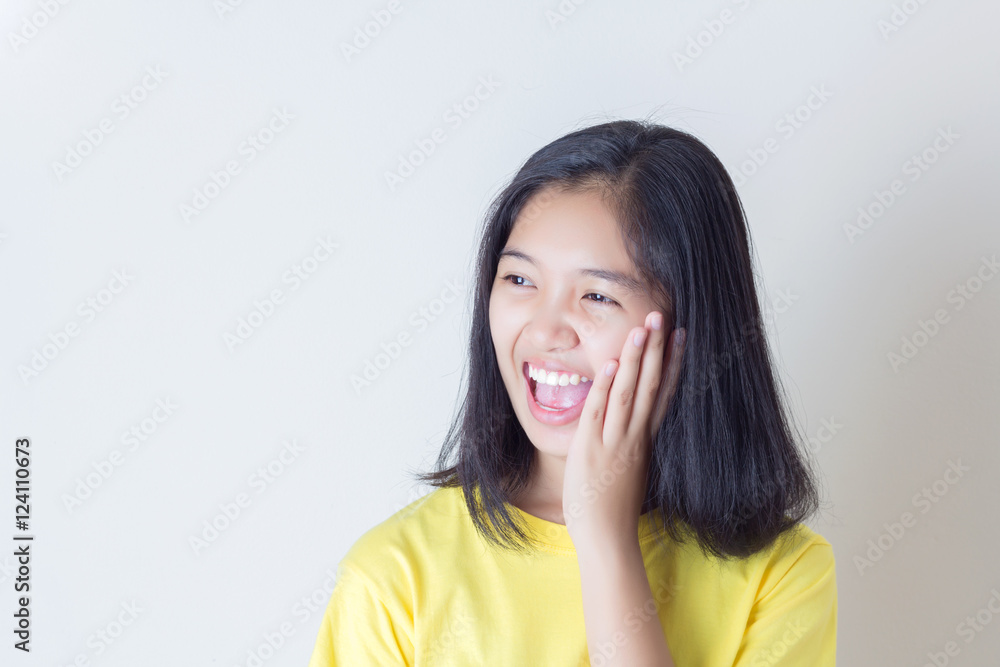 Fototapeta premium Surprised excited girl on white background. Cheerful multiracial