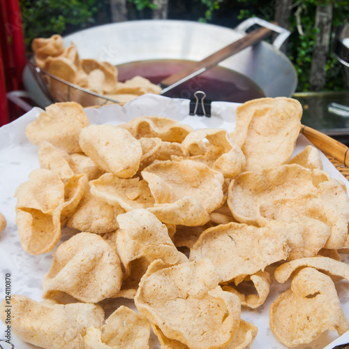 Fresh made Prawn Crackers (Krupuk) on white plate photo