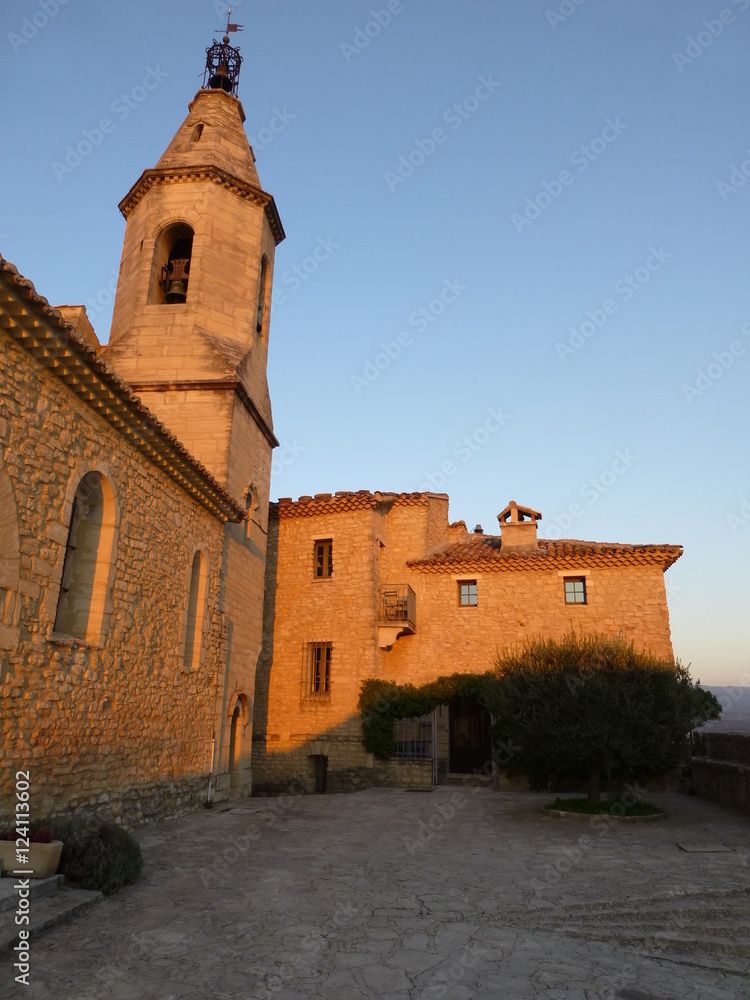 Church in the Provencal village of Crillon-le-Brave caught by the last rays of the setting sun