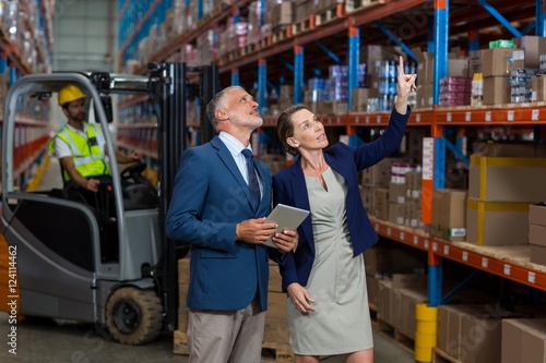 Warehouse manager and client interacting with each other