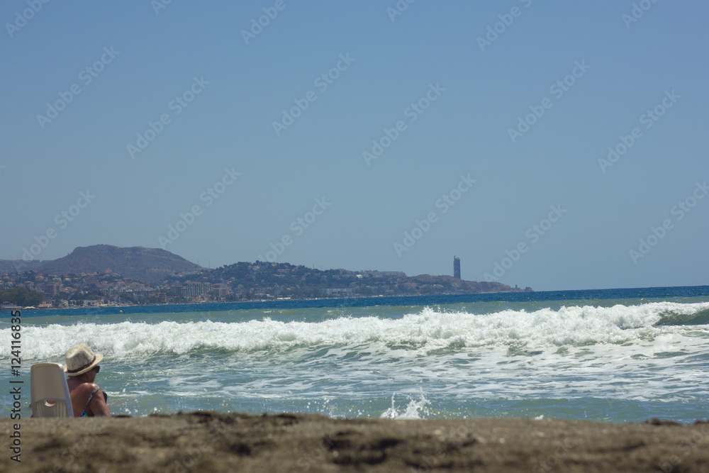 Elderly woman resting by the sea Elderly woman resting by the sea