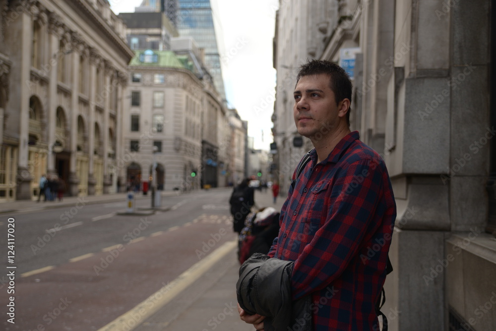 Man waiting for the bus in London after an job interview Man waiting for the bus in London after an job interview
