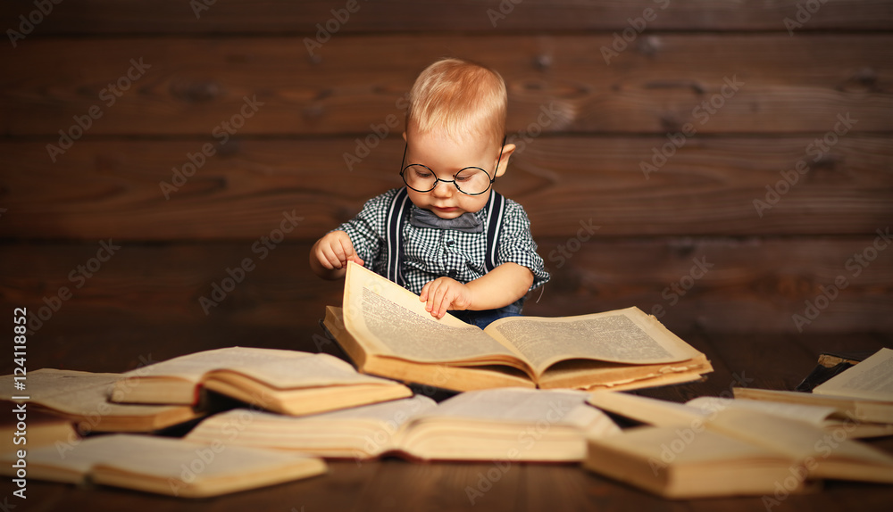 funny baby with books in glasses funny baby with books in glasses