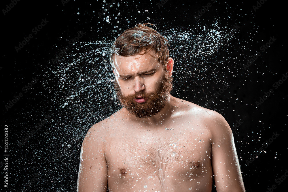 The water splash on male face