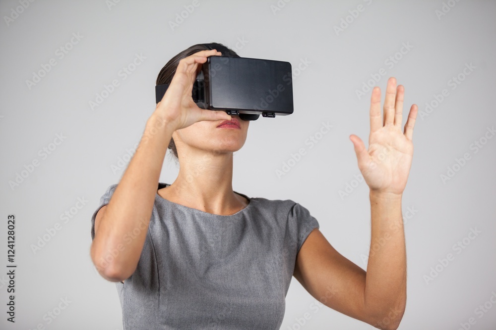 Woman using virtual reality headset Woman using virtual reality headset