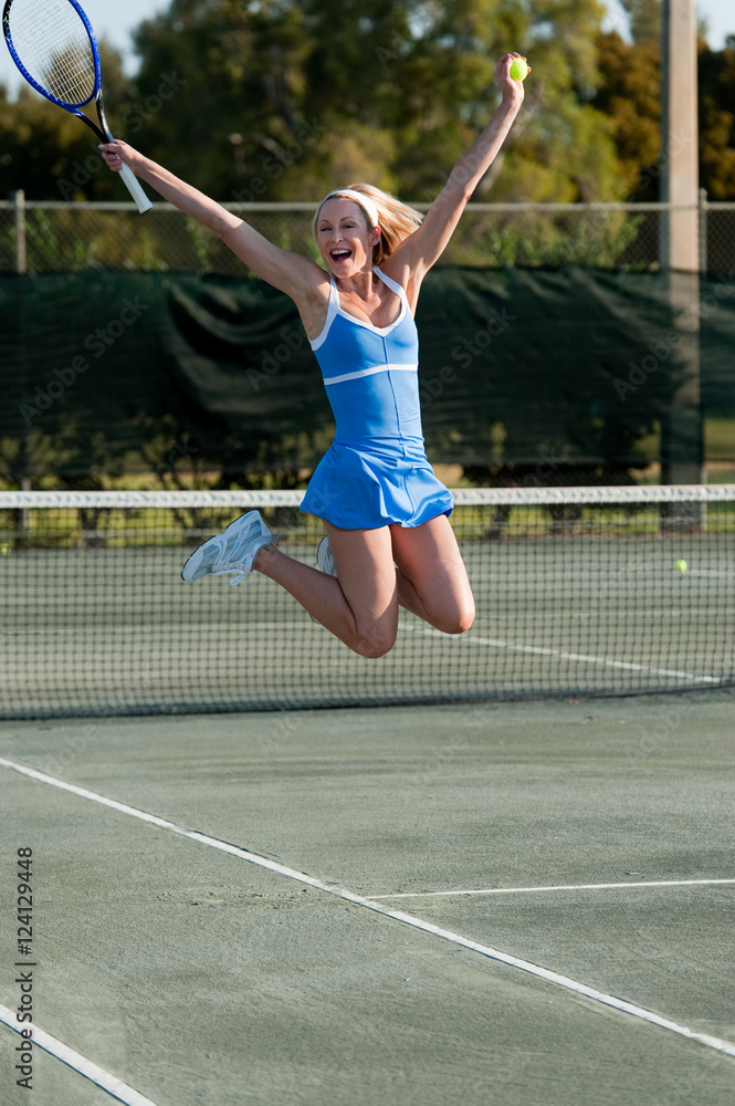 Blond Woman Tennis Player Jumping Celebrating