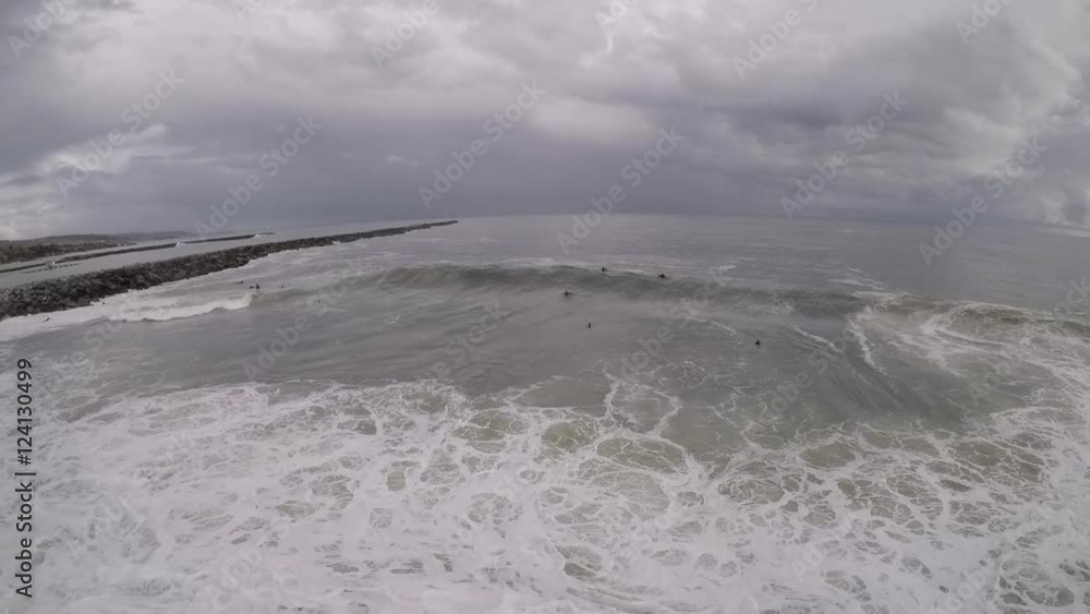 Surfers and bodyboarders at 'The Wedge' in Newport Beach, CA, aerial drone footage. Surfers and bodyboarders at 'The Wedge' in Newport Beach, CA, aerial drone footage.