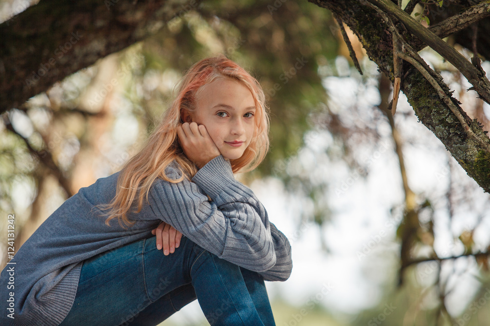 The little girl in the autumn forest The little girl in the autumn forest