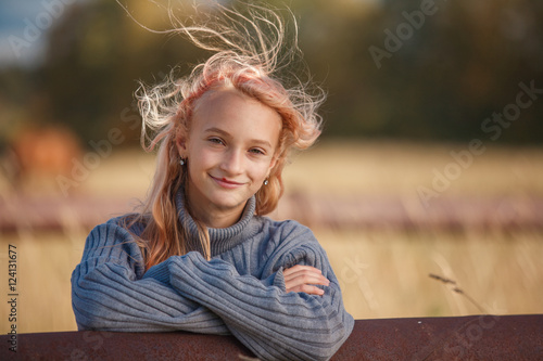 The little girl in the autumn forest