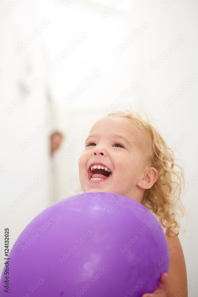 Cute little girl holding balloon and laughing Cute little girl holding balloon and laughing